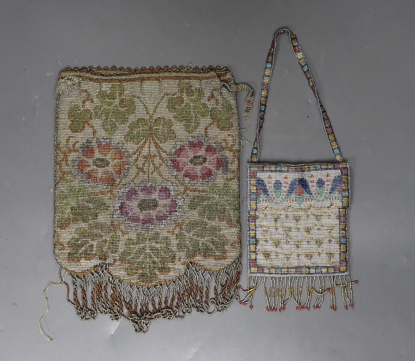 A fine multicoloured metal beaded bag, with shaped tasselled edge and a smaller similar worked purse with abstract design, both 1900-1920